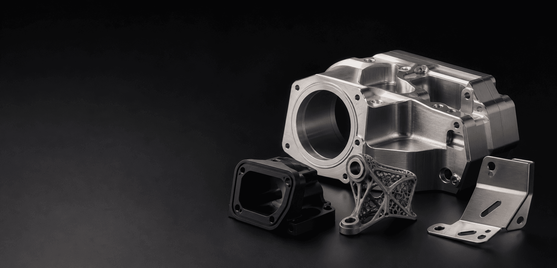 Precision-machined metal components arranged in a dark product studio